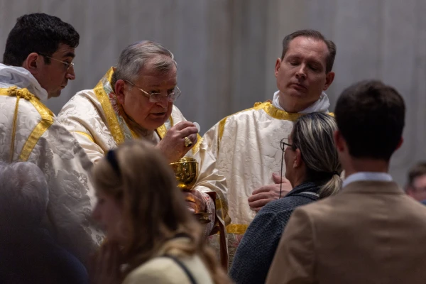 Cardinal Raymond Leo Burke distributes Holy Communion at a Pontifical Mass in the Extraordinary Form of the Roman Rite at the Papal Basilica of Saint Peter, the Vatican, Saturday, Oct. 25, 2025. Credit: Daniel Ibáñez/CNA