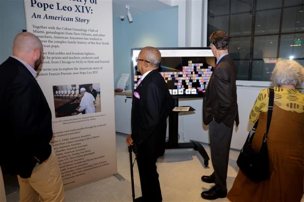 Dr. Henry Louis Gates Jr. and other guests explore the exhibit at American Ancestors headquarters in Boston. Credit: Claire Vail, VP of Communications & Digital Strategy for American Ancestors
