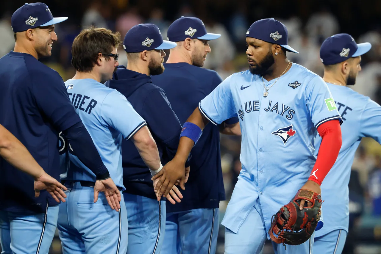 LOS ANGELES, CALIFORNIA - OCTOBER 28: Vladimir Guerrero Jr. #27 of the Toronto Blue Jays reacts with teammates after their 6-2 win over the Los Angeles Dodgers in game four of the 2025 World Series at Dodger Stadium on October 28, 2025 in Los Angeles, California. (Photo by Ronald Martinez/Getty Images)