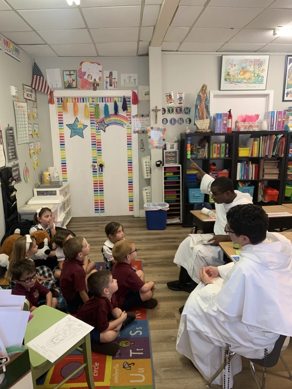The Dominicans visit the school once a week to read, answer questions, or give a talk to the students at Faustina Academy. Credit: Photo courtesy of Faustina Academy