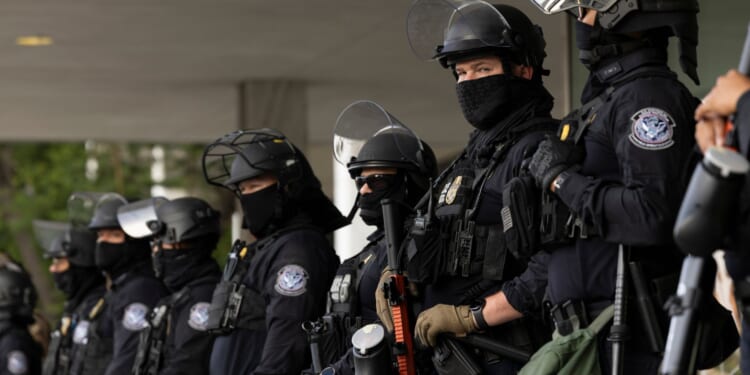 Federal Agents Tackle a Female Protester After Water Bottle Thrown at ICE in Minneapolis [WATCH]