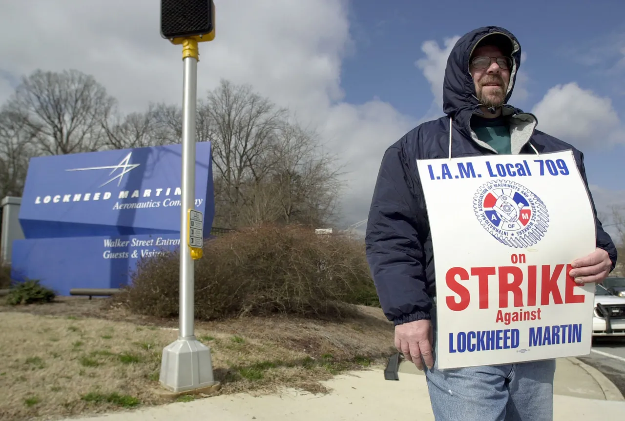 MARIETTA, GA - MARCH 8: Randy Brown, a member of the International Association of Machinists Local 709, walks the picket line outside the Lockheed Martin plant March 8, 2005 in Marietta, Georgia. The workers, who help build the F/A-22 fighter and C-130J transport planes, went on strike at midnight when they rejected a contract which would have raised their wages 10 percent over three years. Workers at two other Lockheed plants ratified the contract. (Photo by Erik S. Lesser/Getty Images)