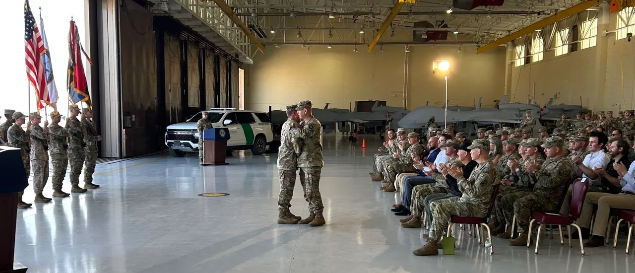 Commanders from the 101st Airborne Division and the 10th Mountain Division participate in a ceremony changing authority to the 101st.