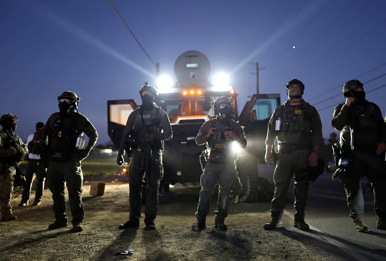 Federal agents block people protesting an ICE immigration raid at a nearby licensed cannabis farm on July 10, 2025. (Photo by Mario Tama/Getty Images)