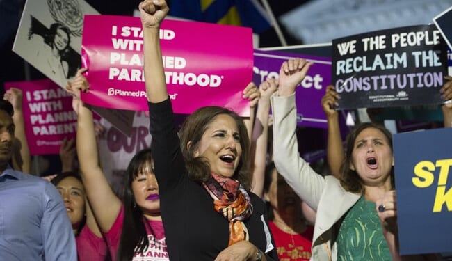 Democrats’ Violent Rhetoric Peaks with Tanden’s ‘Sign from God’ Jab at Earle-Sears’ Burning Campaign Bus – Twitchy