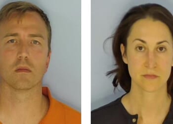 Executive and her husband arrested, accused of leaving sleeping infant alone on a beach nearly an hour