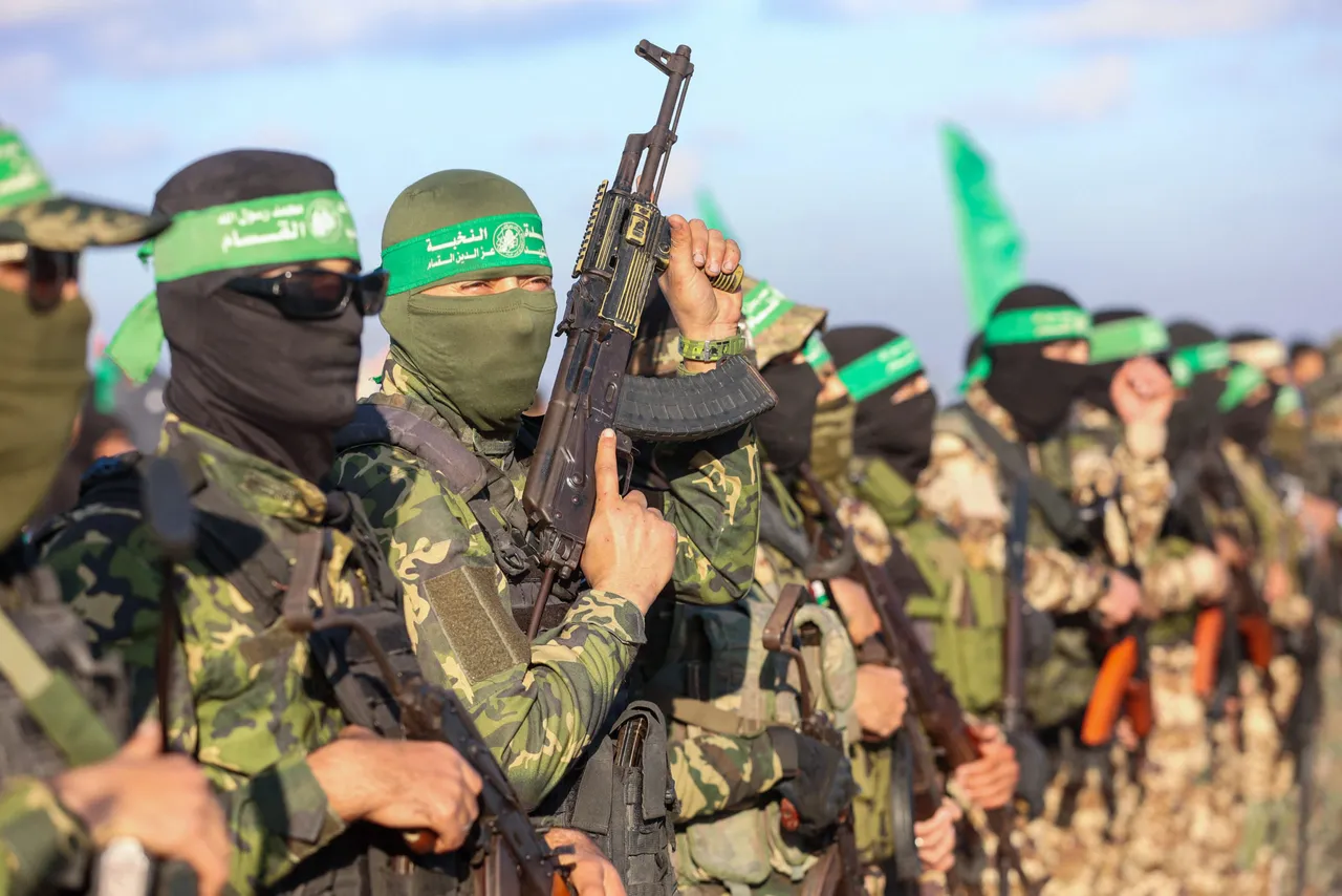 Palestinian militant group Hamas fighters secure an area before handing over an Israeli-America hostage to a Red Cross team in Gaza City on February 1, 2025, as part of the fourth hostage-prisoner exchange. (Photo by OMAR AL-QATTAA/AFP via Getty Images)