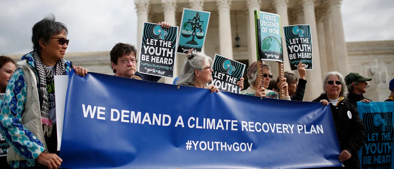 Protesters attend a rally outside the U.S. Supreme Court held by the group Our Children’s Trust October 29, 2018 in Washington, DC. (Photo by Win McNamee/ via Getty Images)