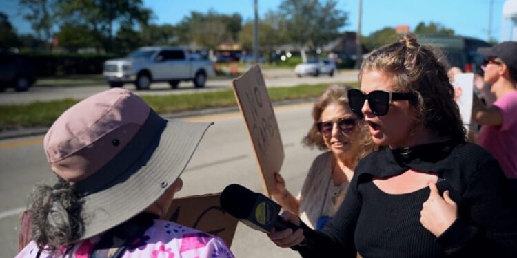 Lady at rally casually tells polite reporter that she’s glad Charlie was killed and she should suffer same fate
