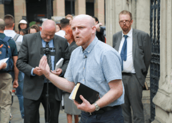Ministers gather outside Parliament in London for open-air witness