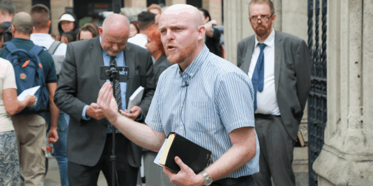 Ministers gather outside Parliament in London for open-air witness