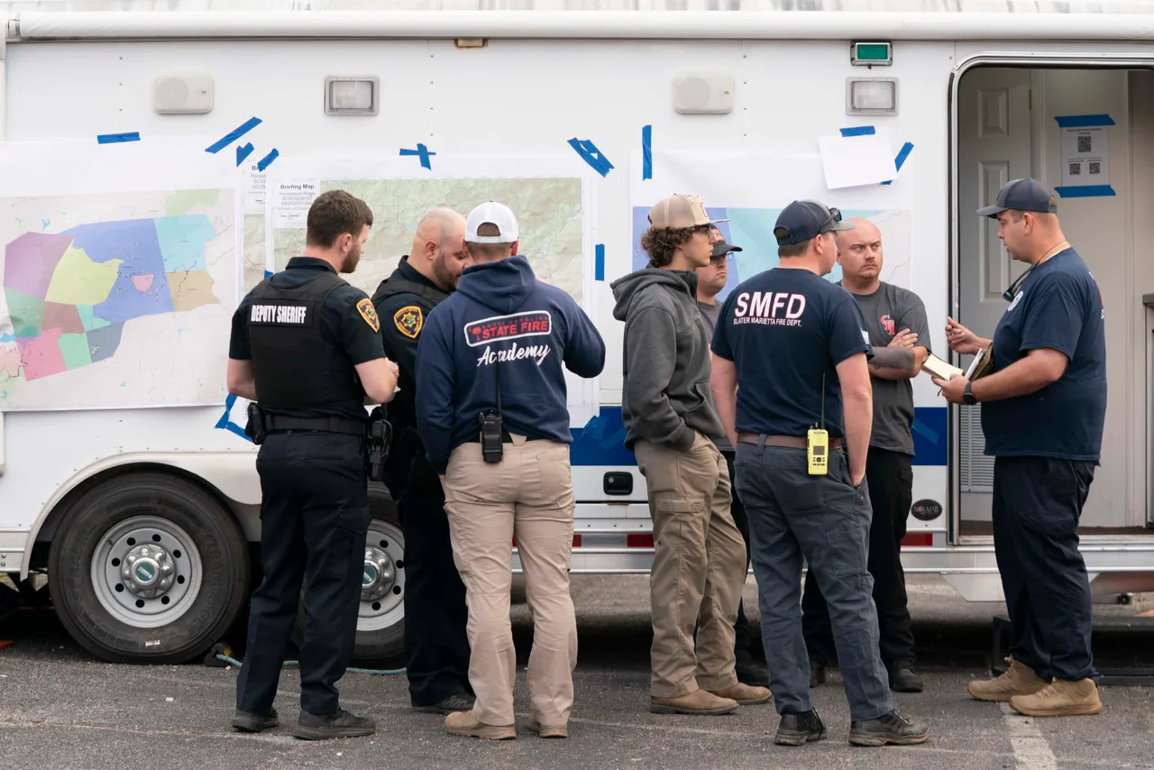 Firefighters and emergency personnel gather at a staging ground near the Table Rock Complex fire on March 26, 2025 in Pumpkintown, South Carolina. (Photo by Sean Rayford/Getty Images)