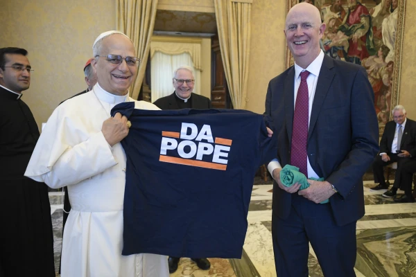 Pope Leo receives a T-shirt that notes his Chicago roots in a meeting with American labor leaders on Oct. 9, 2025, at the Vatican. Credit: Vatican Media