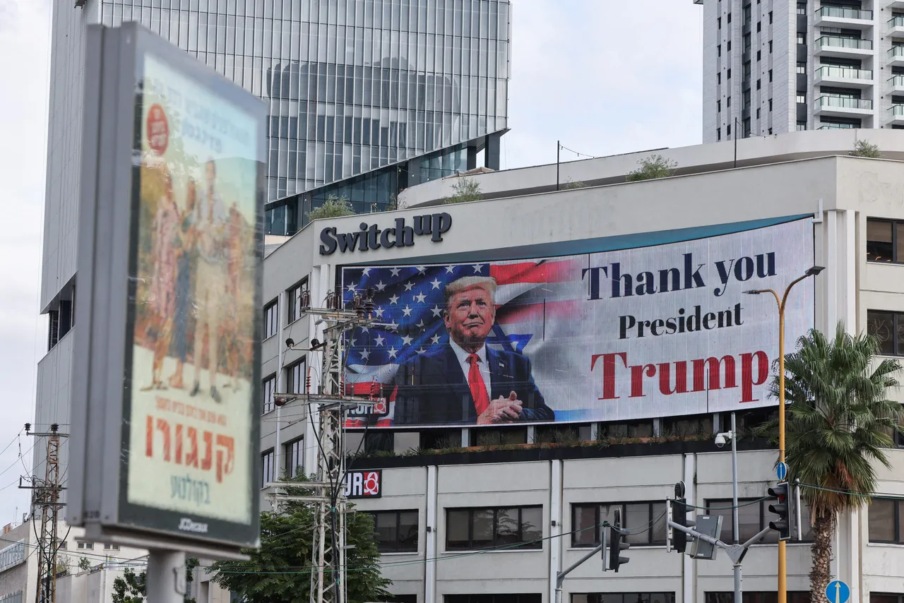 A billboard displays an image of US President Donald Trump with a message thanking him for reaching a ceasefire deal in Gaza (Photo by JACK GUEZ/AFP via Getty Images)