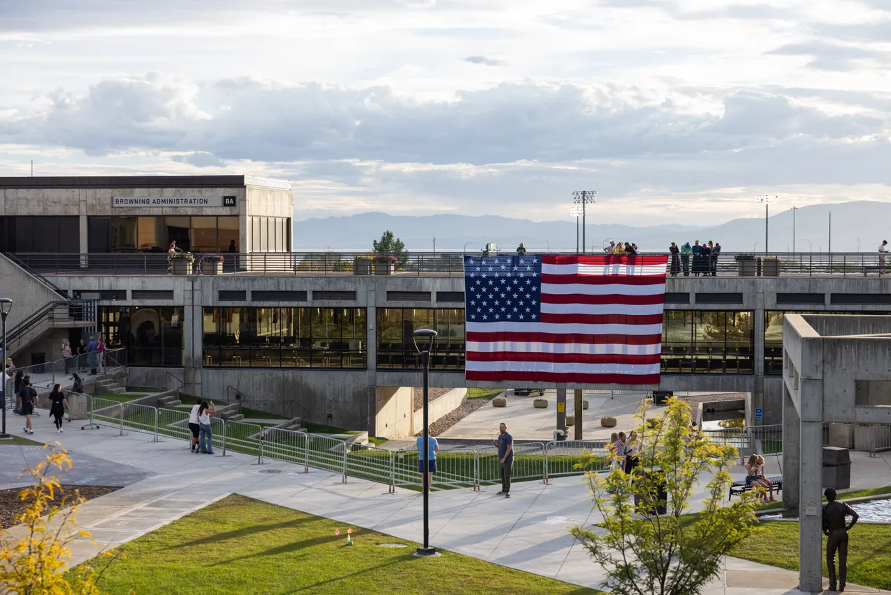 A US flag is displayed in memory of right-wing political activist Charlie Kirk at the main campus of Utah Valley University in Orem, Utah, on September 19, 2025. (Photo by MELISSA MAJCHRZAK/AFP via Getty Images)