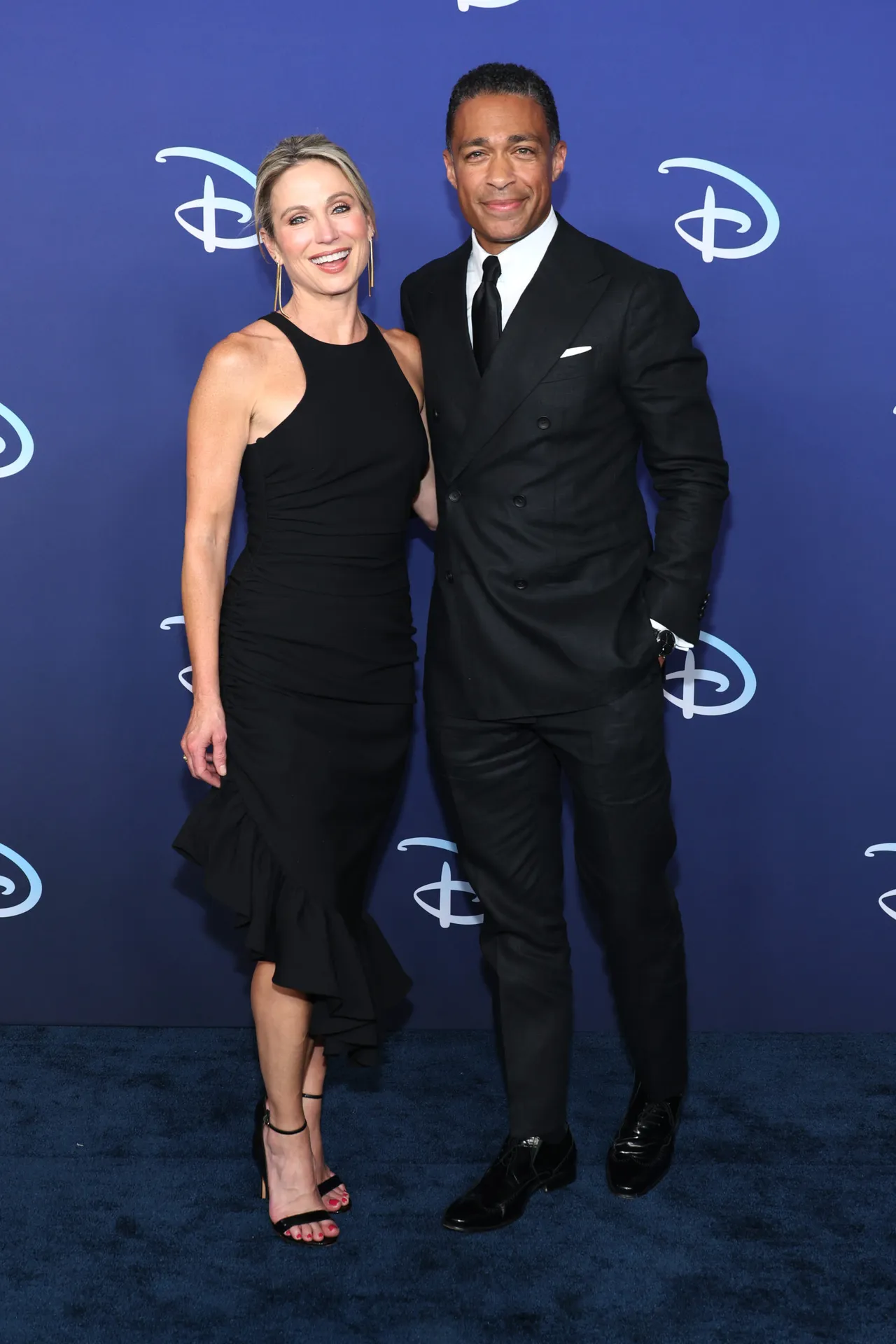 NEW YORK, NEW YORK - MAY 17: Amy Robach and TJ Holmes attend the 2022 ABC Disney Upfront at Basketball City - Pier 36 - South Street on May 17, 2022 in New York City. (Photo by Dia Dipasupil/Getty Images,)