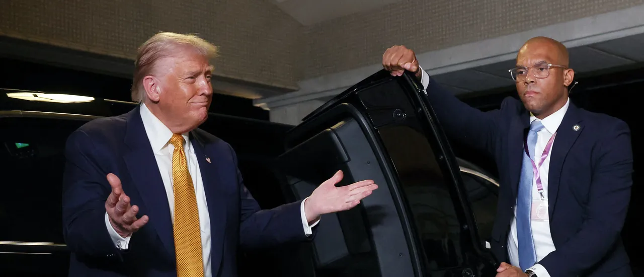 US President Donald Trump gestures as he is welcomed by Japan's Emperor Naruhito upon his arrival at the Imperial Palace in Tokyo on October 27, 2025.