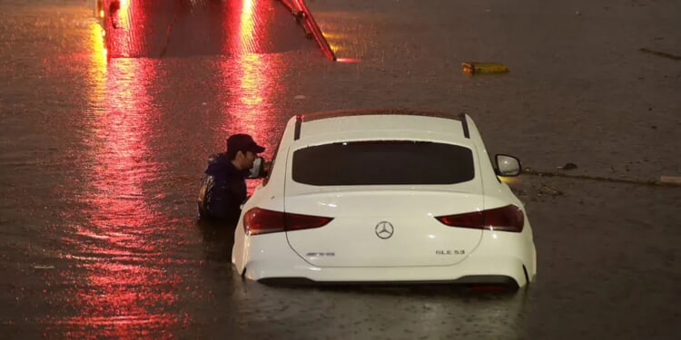 Wild Video Shows Man, Child Trapped On Top Of Car Surrounded By Roaring Floodwaters In Arizona