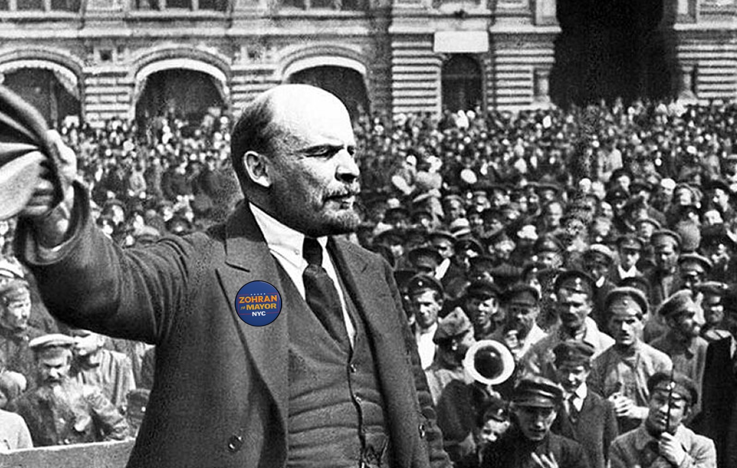 Historical figure addressing crowd with campaign button.