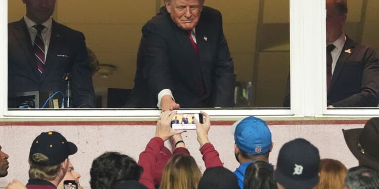 Commanders fans greet Trump with mix of boos, applause