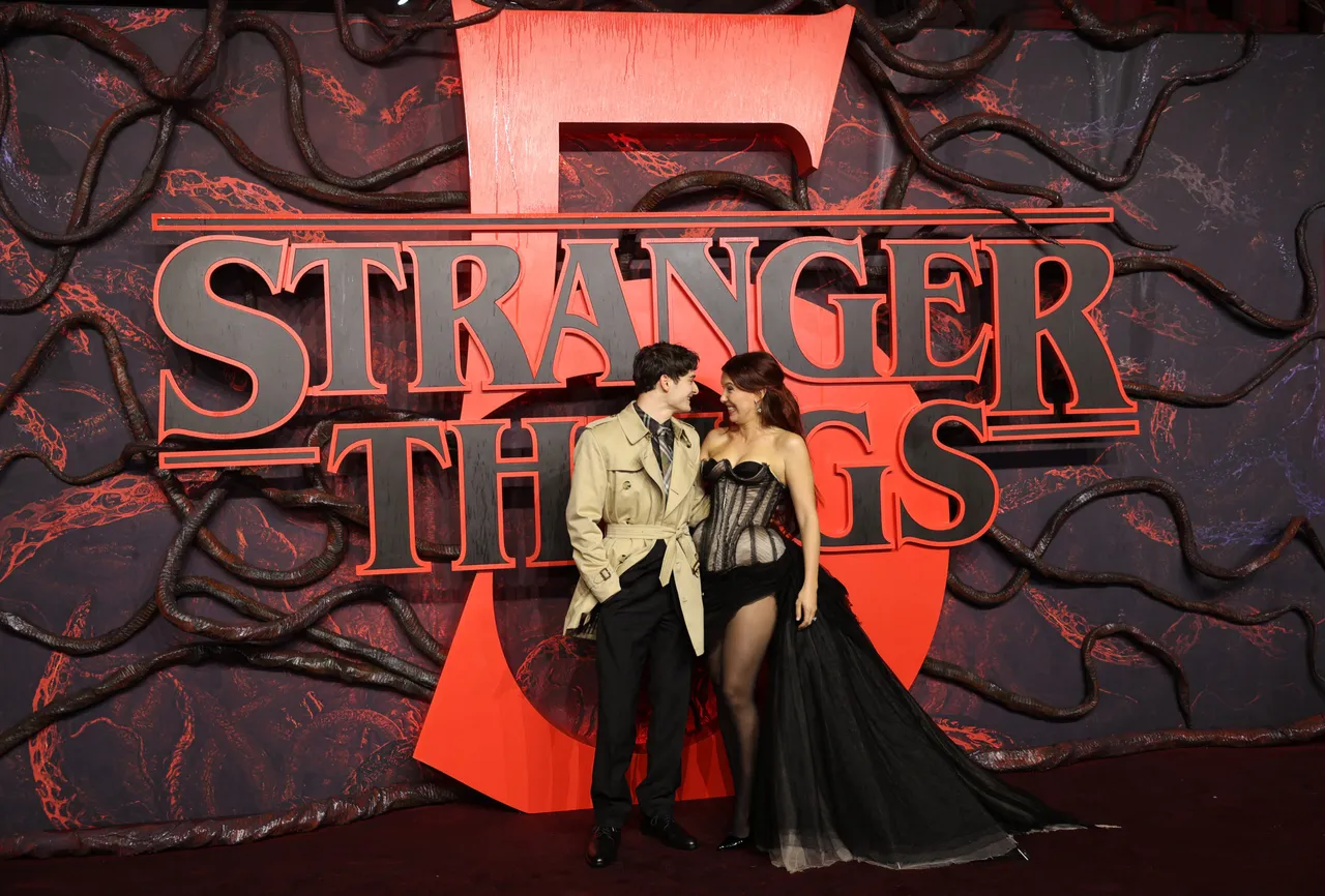 US actor Noah Schnapp (L) and British actor Millie Bobby Brown arrives to attend the UK special screening of the Netflix series 'Stranger Things 5', at Leicester Square in central London on November 13, 2025. (Photo by Toby Shepheard / AFP) (Photo by TOBY SHEPHEARD/AFP via Getty Images)