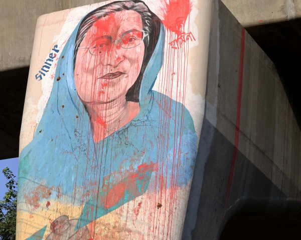 A satirical caricature of former Prime Minister Sheikh Hasina, drawn by students on the eve of the 2024 student uprising, can still be seen on the pillars of the Dhaka Metrorail in Bangladesh. Credit: Stephan Uttom Rozario