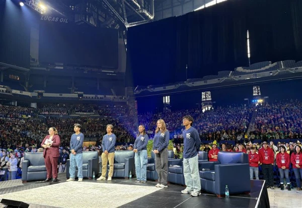 Moderator Katie McGrady and teens Ezequiel Ponce, Chris Pantelakis, Mia Smothers, Elise Wing, and Micah Alcisto speak with Pope Leo XIV during a live digital encounter at Lucas Oil Stadium on Nov. 21, 2025. Credit: Tessa Gervasini/CNA
