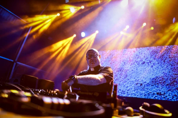 Guilherme Peixoto, a priest and DJ, performs onstage during a fair in Coimbra, Portugal, on July 4, 2024. Credit: Felipe Amorim/Getty Images