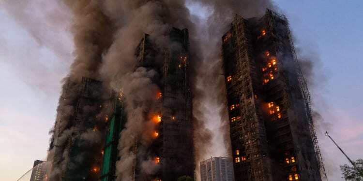 Fire engulfs bamboo scaffolding at Hong Kong high-rise residential complex, killing 4