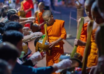 Buddhist monks in Laos pray in region littered with unexploded bombs