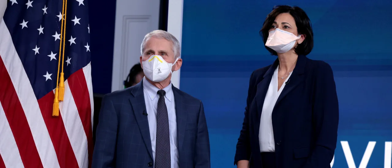Dr. Anthony Fauci, Director of the National Institute of Allergy and Infectious Diseases and the Chief Medical Advisor to the President, and Centers for Disease Control and Prevention Director Rochelle Walensky, arrive for a video call with U.S. President Joe Biden, the White House Covid-19 Response team and the National Governors Association in the South Court Auditorium at the Eisenhower Executive Office Building on December 27, 2021 in Washington, DC. (Photo by Anna Moneymaker/Getty Images)
