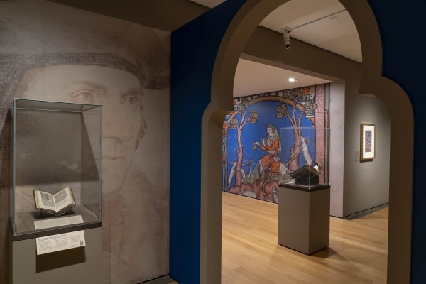The Prayer Book of Thomas More is backed by a wall-sized image of Hans Holbein’s 
