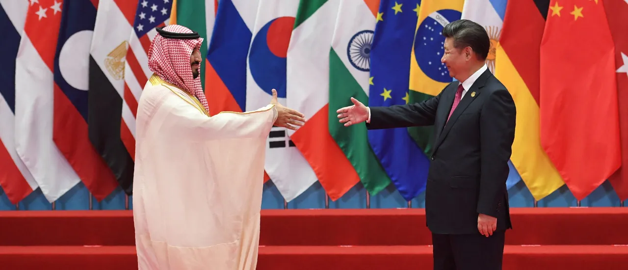 Saudi Arabia's Deputy Crown Prince and Minister of Defense Muhammad bin Salman Al Saud shakes hands with China's President Xi Jinping (R) before the G20 leaders' family photo in Hangzhou on September 4, 2016. World leaders are gathering in Hangzhou for the 11th G20 Leaders Summit from September 4 to 5. (Photo by GREG BAKER/AFP via Getty Images)