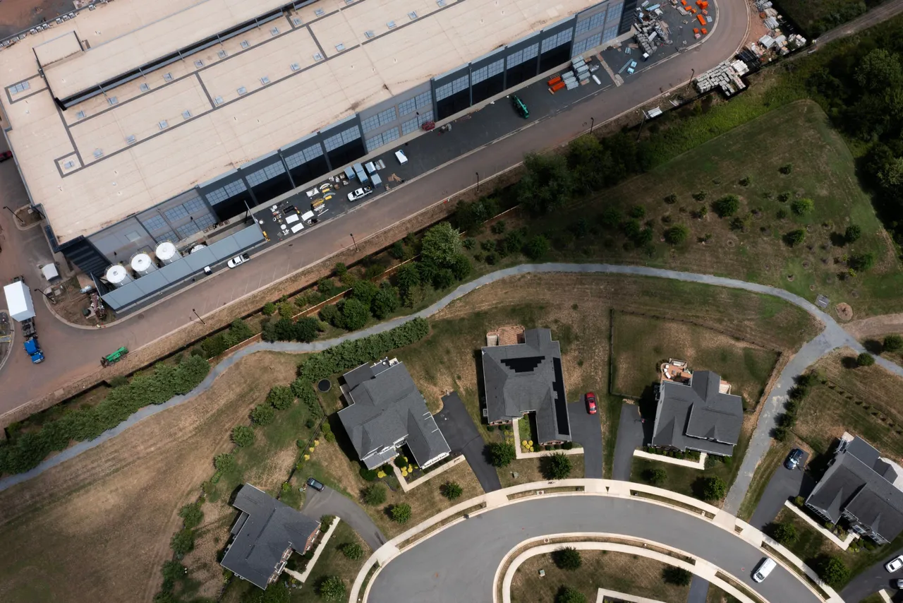 In an aerial view, an Amazon Web Services data center is shown situated near single-family homes on July 17, 2024 in Stone Ridge, Virginia. (Photo by Nathan Howard via Getty Images)