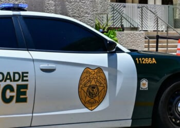 Chaotic Video Footage Seemingly Shows Police Forcibly Taking Island Boys Member Into Custody