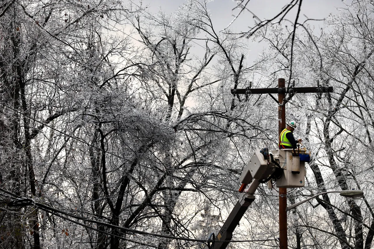 A worker repairs power lines as winter storm brings havoc to New Jersey as ice caused power outages and downed trees throughout the area on December 18, 2019 in West Orange, New Jersey.