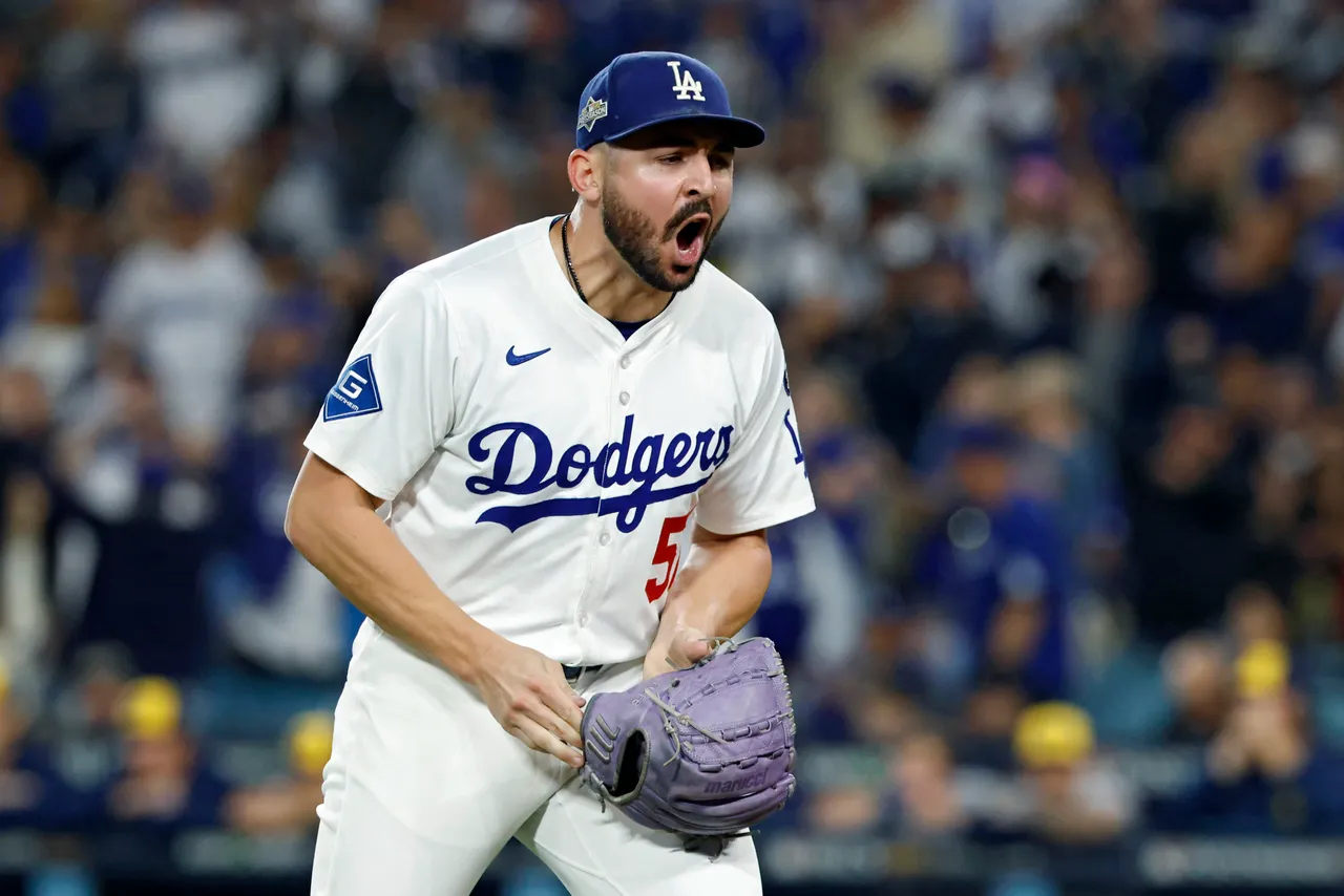 LOS ANGELES, CALIFORNIA - OCTOBER 17: Alex Vesia #51 of the Los Angeles Dodgers reacts after the third out in the seventh inning against the Milwaukee Brewers in game four of the National League Championship Series at Dodger Stadium on October 17, 2025 in Los Angeles, California. (Photo by Ronald Martinez/Getty Images)
