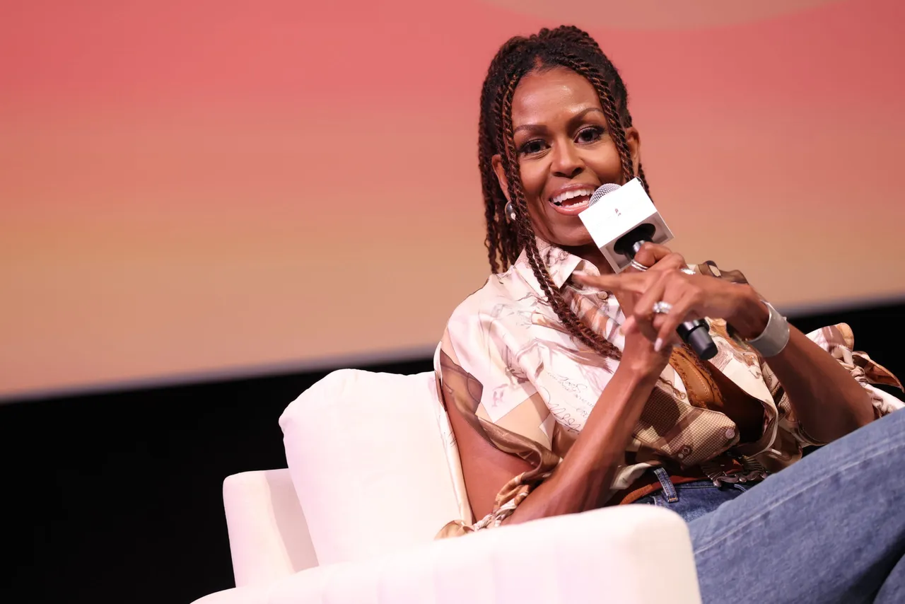 MARTHA'S VINEYARD, MASSACHUSETTS - AUGUST 09: Michelle Obama speaks during Higher Ground's "IMO with Michelle Obama & Craig Robinson" podcast during 2025 Martha's Vineyard African American Film Festival at Martha's Vineyard Performing Arts Center on August 09, 2025 in Martha's Vineyard, Massachusetts. (Photo by Arturo Holmes/Getty Images)
