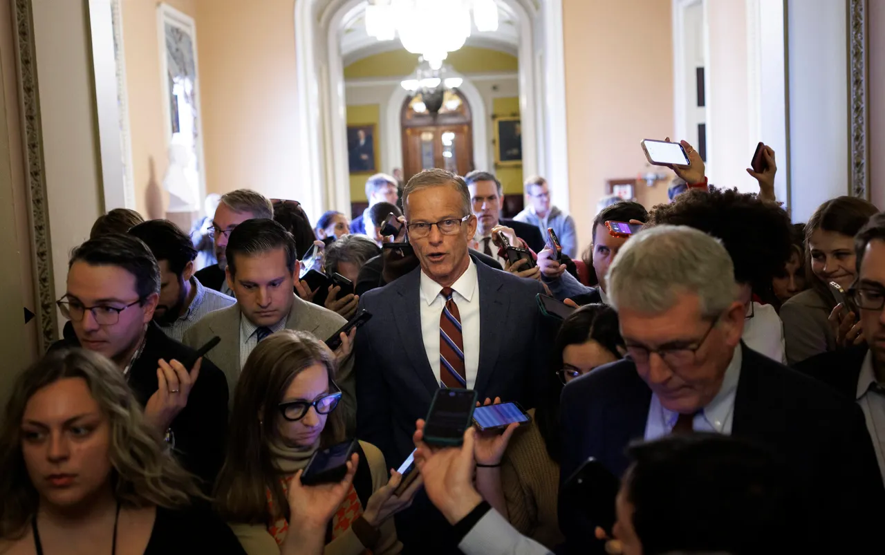 Senate Majority Leader John Thune speaks to reporters while walking to his office on November 10, 2025 on Capitol Hill in Washington, DC.