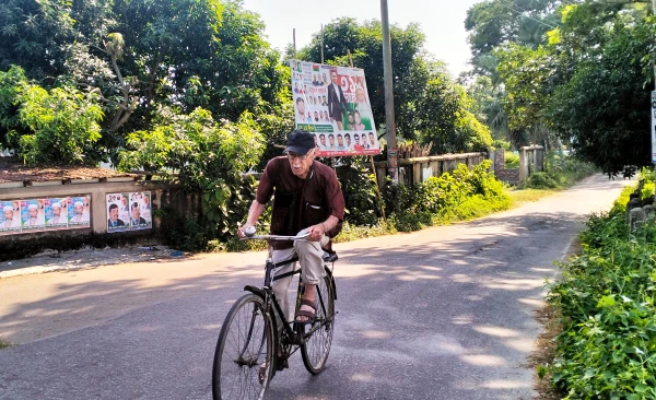 Father Robert Terence McCahill, 88, rides his bicycle through rural villages in Munshigonj district, Bangladesh, on Nov. 18, 2025. Credit: Stephan Uttom Rozario