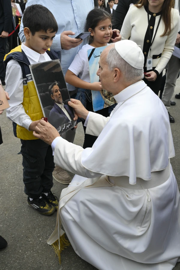 Pope Leo XIV greets a young child at the site of the Aug. 4, 2020, blast at the Port of Beirut on Dec. 2, 2025. Credit: Vatican Media
