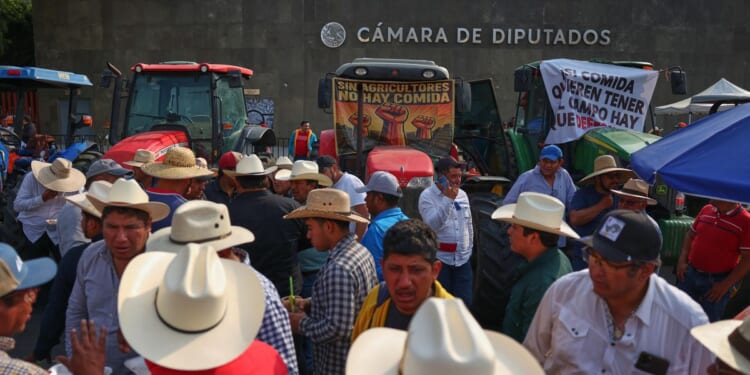 Farmers block Mexico's Congress with tractors in protest against new national water law proposal