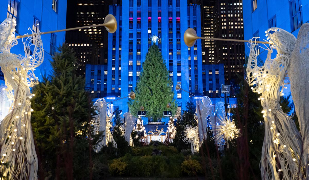 The Rockefeller Center Christmas tree, a holiday icon, lights up in New York