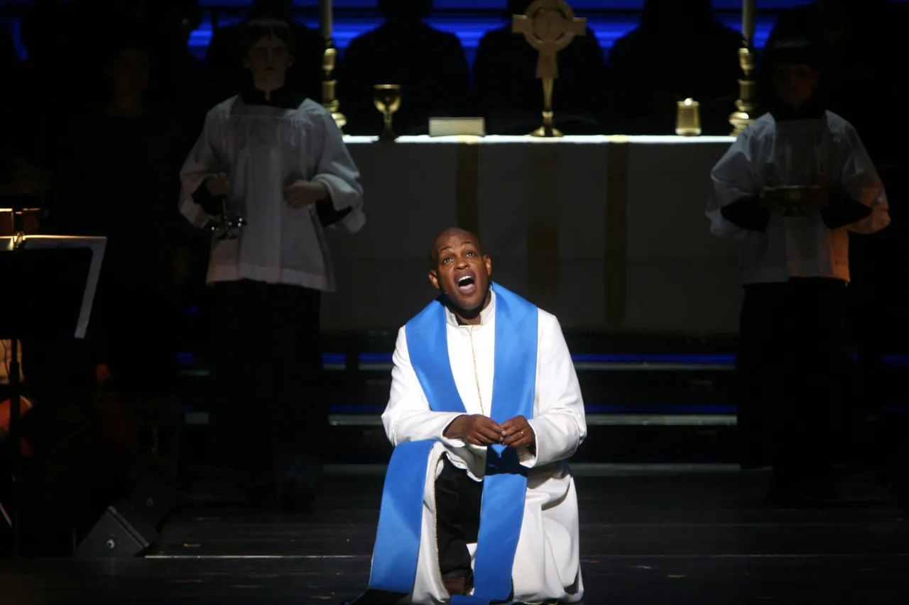 Baltimore Symphony Orchestra in Leonard Bernstein's "Mass" at Carnegie Hall on Friday night, October 24, 2008.The orchestra was joined by Street Chorus, Morgan State University Choir, Brooklyn Youth Chorus and Stony Brook University Marching Band.This image;Jubilant Sykes, in white, as Celebrant. (Photo by Hiroyuki Ito/Getty Images)