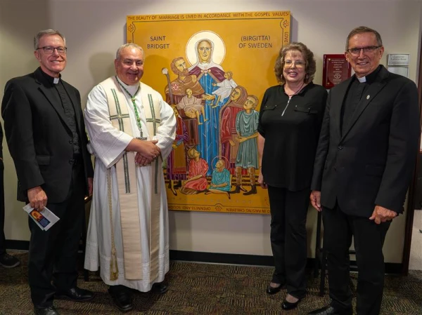 At the blessing ceremony of the icon are (left to right): FOCCUS Director of Ministry Father Michael Grewe, Archbishop Michael McGovern of Omaha, FOCCUS Executive Director Sheila Simpson, and Iconographer Father Richard Reiser. Credit: Photo courtesy of FOCCUS