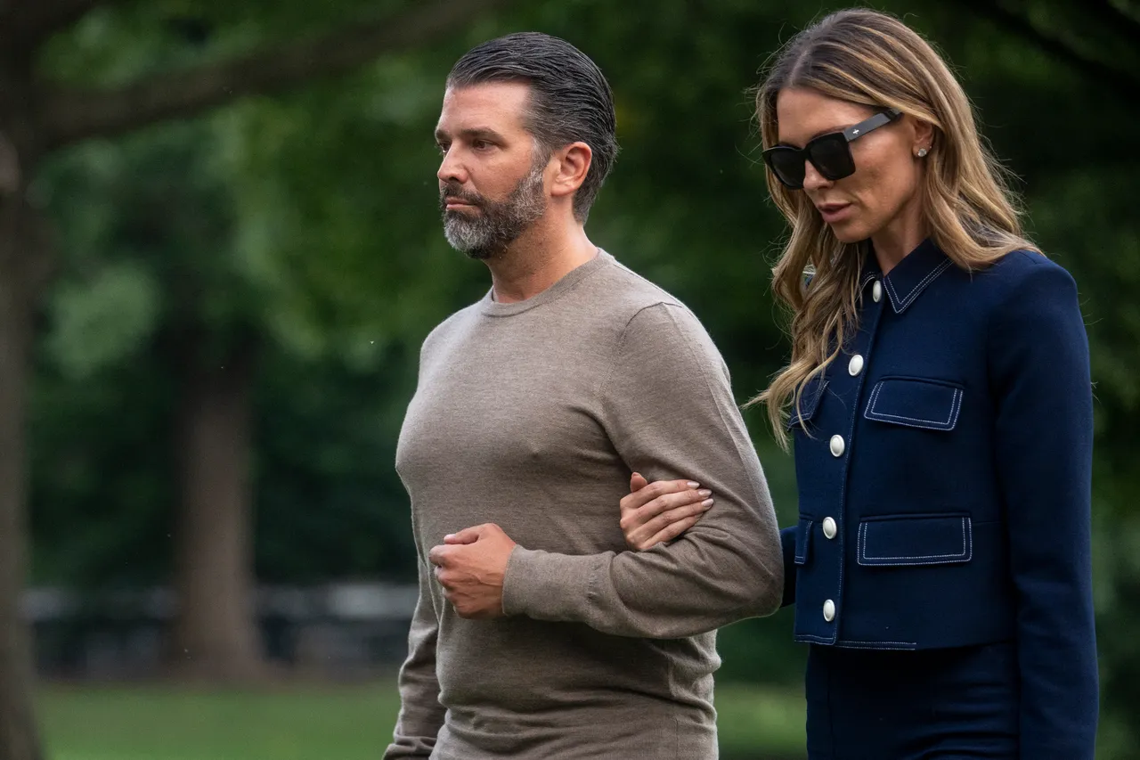 Donald Trump Jr. walks with Bettina Anderson as they arrive on the South Lawn of the White House in Washington, DC, on July 29, 2025. Trump returned to Washington following a trip to Scotland. (Photo by Jim WATSON / AFP) (Photo by JIM WATSON/AFP via Getty Images)