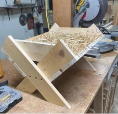 Manger made by an 88-year-old parishioner of St. Stephen’s in Renton, Washington. Carolers brought the empty manger to the caroling event on Dec. 14, 2025, as a sign of what an abortion does and the empty space it leaves. Credit: Photo courtesy of Richard Bray