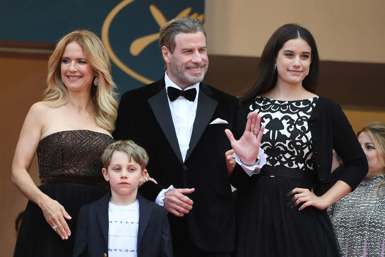 US actor John Travolta (2ndR), his wife US actress Kelly Preston (L) and their children Ella Bleu Travolta (R) and Benjamin Travolta pose as they arrive on May 15, 2018 for the screening of the film 