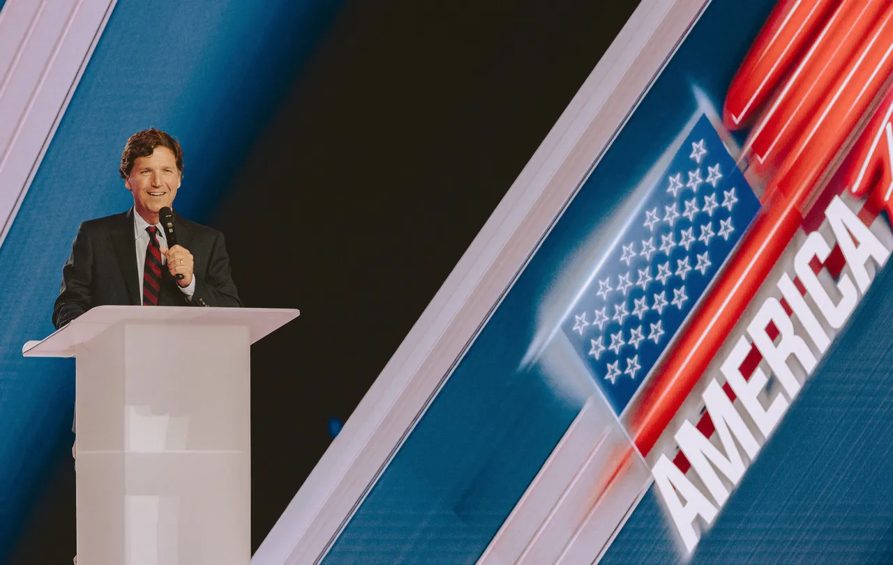 Conservative political commentator and podcast host Tucker Carlson speaks at Turning Point's annual AmericaFest. (Photo by Olivier Touron / AFP via Getty Images)