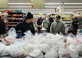 Families wait in line for hours to buy masa for Christmas tamales at beloved L.A. grocer